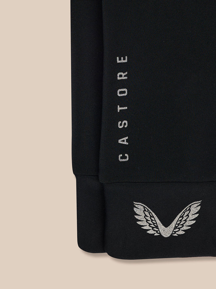 Close-up of black Castore Core Glove showing vertical CASTORE branding along the wrist and wing emblem on the cuff