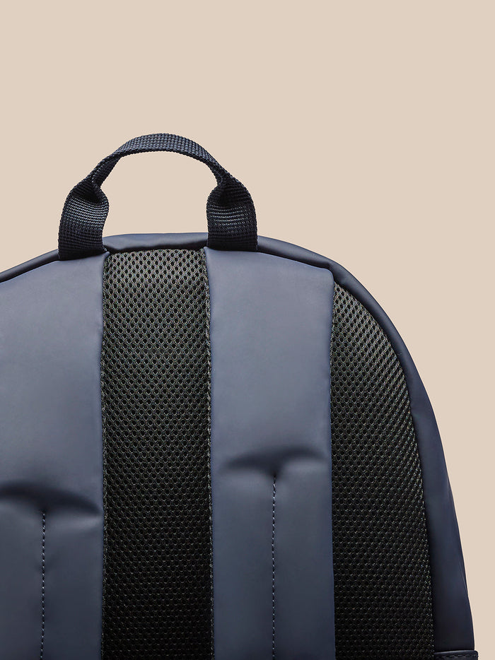 Navy Active Small Backpack viewed from the back showing padded shoulder straps, top handle and mesh back