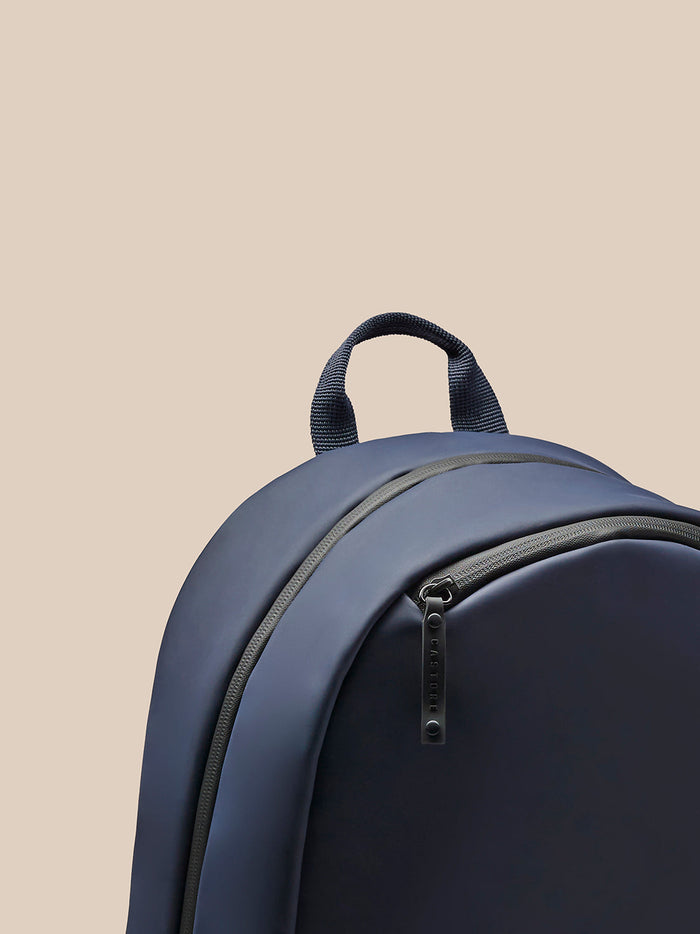 Navy Active Small Backpack viewed from the back showing padded shoulder straps, top handle and mesh back