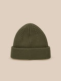 Ivy green ribbed knit beanie with folded cuff and Castore logo patch against a neutral beige background