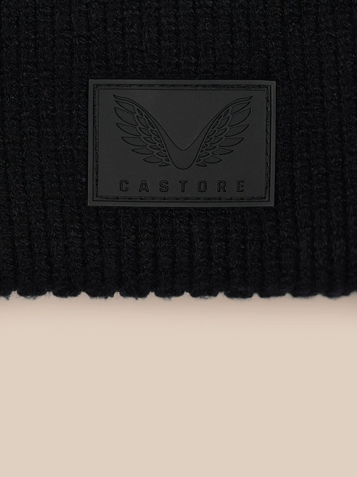 Close-up of Castore logo patch on the beanie cuff