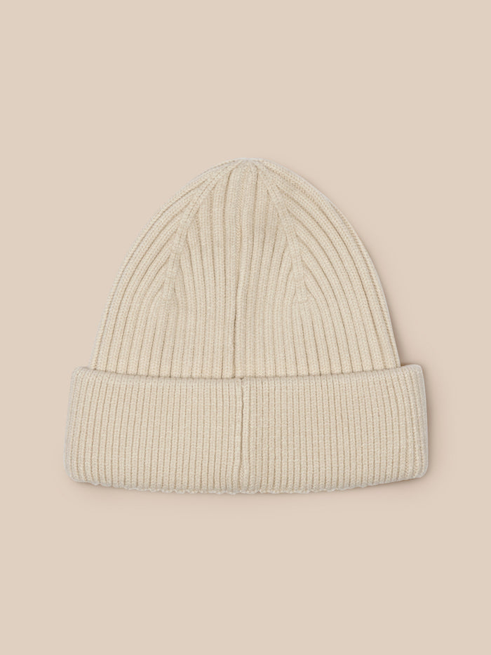 Stone unisex ribbed knit beanie with folded cuff and Castore logo at the fold