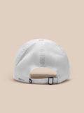 Back view of white Castore cap showing adjustable strap and PROTEK branding