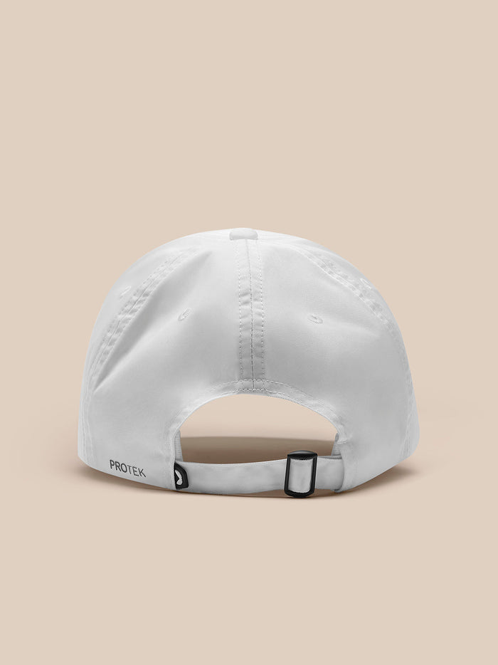 Back view of white Castore cap showing adjustable strap and PROTEK branding
