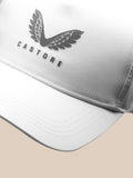 Close up of the front of a white Castore cap featuring the winged logo and branding