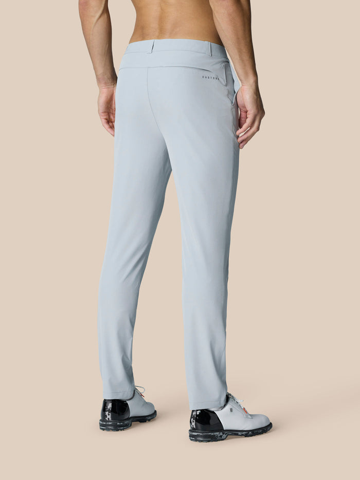 Back view of a man in light grey Golf Club Trousers showing rear pockets with Castore branding.