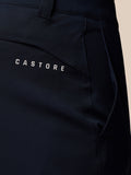 Close up of dark navy golf trouser fabric with Castore branding on the pocket area.