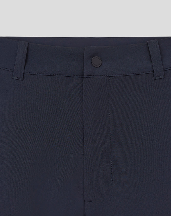 Waist close-up of navy Rangers Golf Trouser featuring belt loops and a central button with Castore branding.