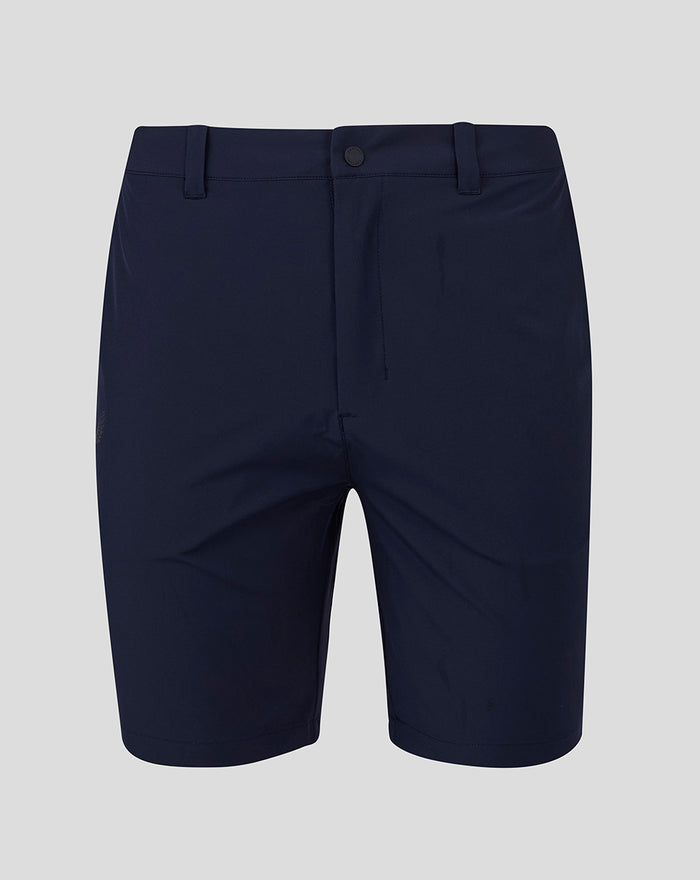 Back view of navy golf shorts with a white lion crest centered on the waistband and belt loops.