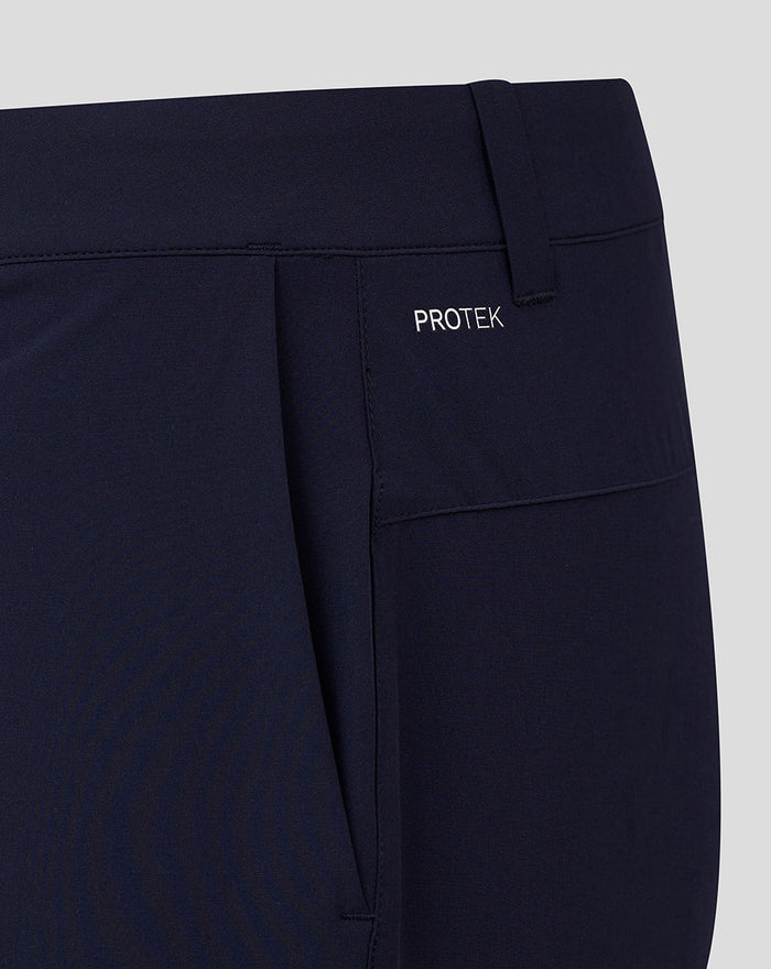 Back view of navy golf shorts with PROTEK branding on the pocket area