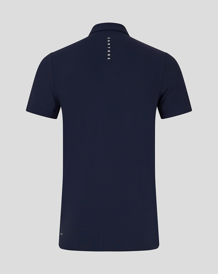 Back view of navy polo showing vertical CASTORE branding along the center back