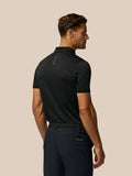 Back view of black Pinnacle Pique Stripe Polo with subtle stripes and Castore branding along upper back