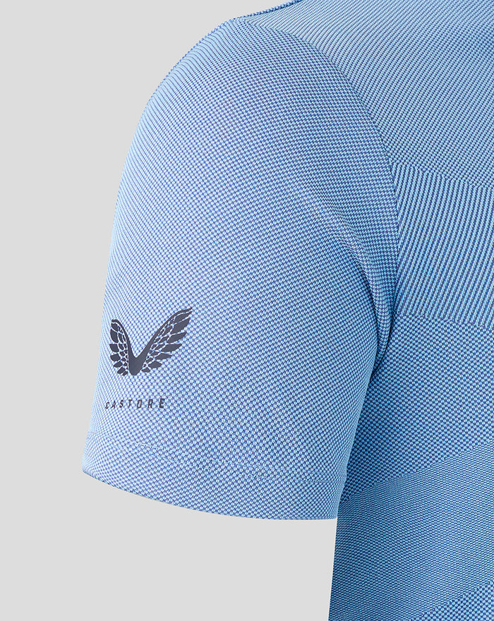 Close up of blue Rangers Pinnacle polo sleeve and shoulder with textured knit and Castore wing emblem on the lower sleeve