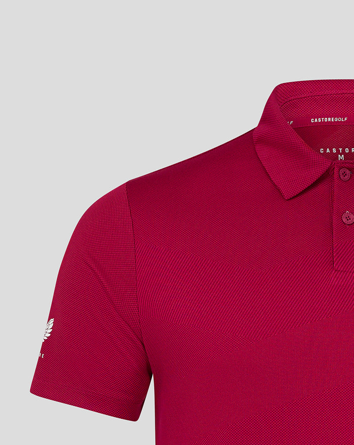 Close-up of a maroon Pinnacle Engineered Knit Polo 2 sleeve and shoulder showing textured knit fabric.