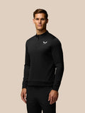 Male model wearing black Golf Club Classic quarter zip top with stand collar and Castore logo on chest