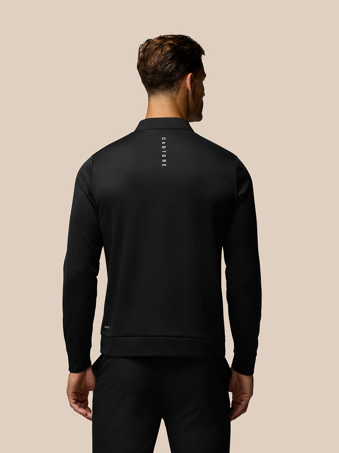 Back view of black Golf Club Classic long sleeve top with vertical CASTORE branding down the spine