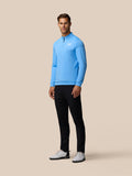 Three quarter back view of man wearing light blue Golf Club Classic quarter zip top