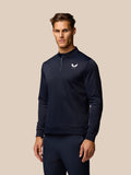 Midnight navy golf top with stand collar and 1/4 zip; Castore branding on left chest and upper back.