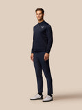 Model wearing GOLF CLUB CLASSIC 1/4 ZIP TOP in midnight navy with quarter zip, stand collar and Castore logo on the left chest.