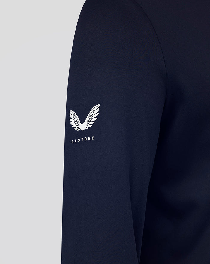 Navy sleeve featuring a white wing logo and CASTORE text.