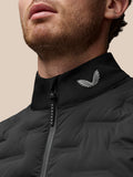Close-up of black Protek gilet collar with a silver wing logo and zipper detail.