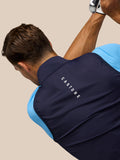 Back view of navy Pinnacle Gilet on a model, Castore branding on collar and upper back