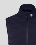 Detail of the navy gilet neck area showing the white lion crest near the zipper and dark collar lining.