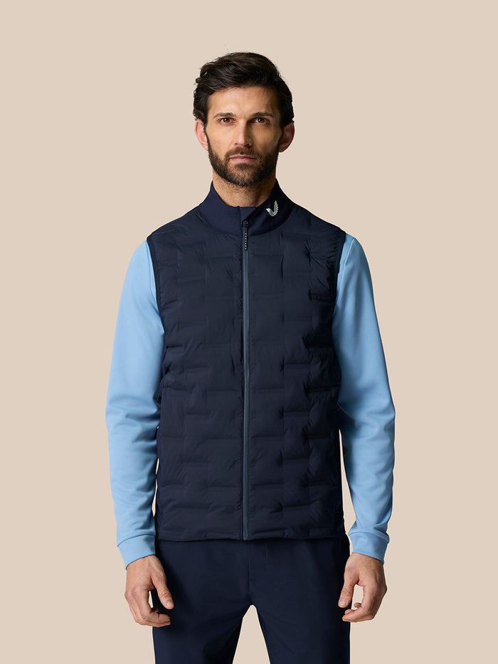 Front view of male model in navy Pinnacle gilet with light blue sleeves