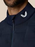 Close-up of the navy collar with the white Castore wing logo and a zip pull reading CASTORE