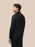 Back view of black Golf Pinnacle Jacket showing quilted front panels and Castore branding along the back of the neck