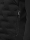 Close-up of black Pinnacle Golf Jacket side zip pocket with puller and quilted front panels.