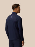 Back view of a man wearing midnight navy Golf Pinnacle jacket with Castore branding along the left collar