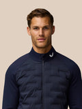 Front view of a man in midnight navy Golf Pinnacle jacket with stand collar and full front zip