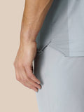 Close-up of mid grey Pinnacle Golf LVS polo fabric with engineered knit and side vent panel.