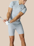 Male golfer wearing Pinnacle LVS Polo in mid grey during a swing.