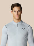 Male model wearing light grey Pinnacle LVS 1/4 zip top with diagonal chest stripes and stand collar