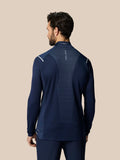 Back view of navy Pinnacle LVS 1/4 Zip golf top with striped vent panel and CASTORE branding.