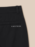 Close-up of the back waist and belt loop area on black golf winter trousers with pocket detail and Castore branding.