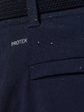 Close-up of navy ProTek water resistant fabric with a waist panel on Golf Pinnacle Winter Trousers