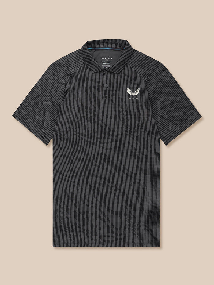 Front flat-lay view of gunmetal mid grey Glow Printed Polo with all-over print and left chest Castore logo.