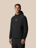 Male golfer wearing black Golf Pinnacle Performance Hoodie with chest logo in a relaxed pose