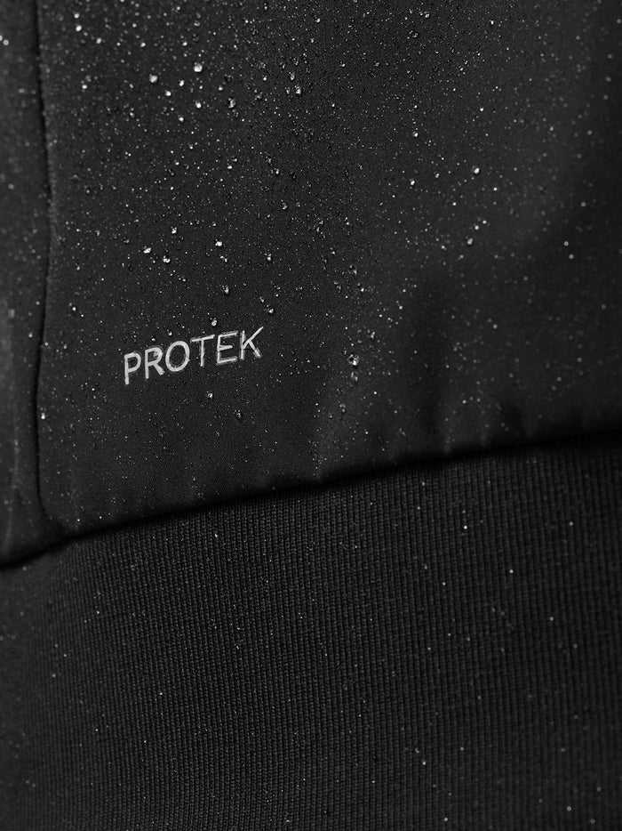 Close up of black ProTek fabric with water droplets beading on the surface