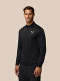 Front view of a man in a black Golf Club Classic quarter zip top with a subtle all over print and chest Castore logo.