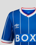 Neckline close-up showing white ribbed V-neck collar with red trim and Umbro logo on blue Rangers jersey.