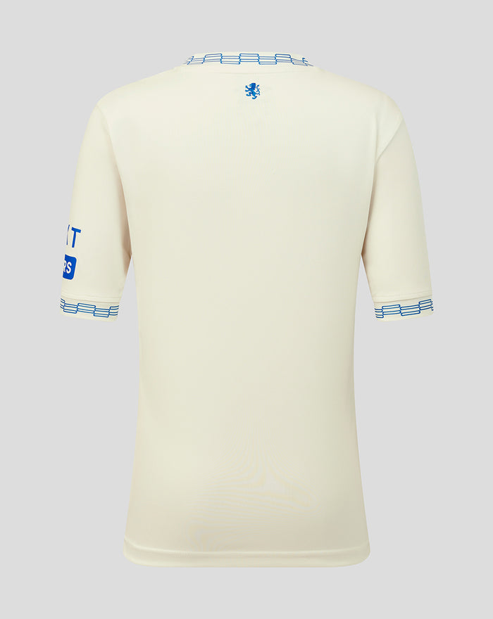 Back view of off-white Rangers junior away shirt with blue ribbed collar and crest near the neckline.