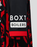 Rangers FC junior third shirt in red with black stripes and crest detailing.