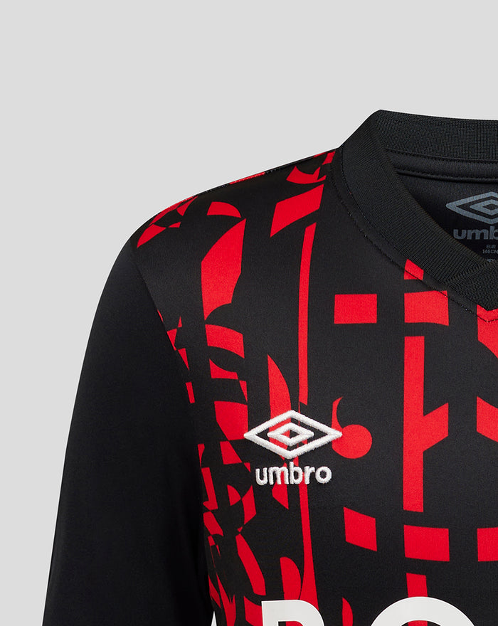 Rangers FC junior third shirt close up with black red graphic fabric and white Umbro logo on the chest