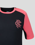 Close-up of navy shirt front with coral pink sleeve and pink Rangers crest on the left chest