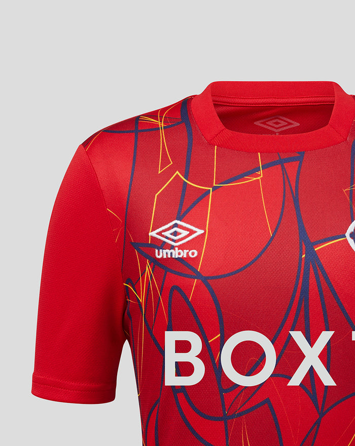 Front close-up of red Rangers FC junior away goalkeeper shirt with bold abstract graphics and large BOX lettering.