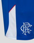 Close up of blue Rangers FC shorts with white side panel and embroidered crest near the hem.